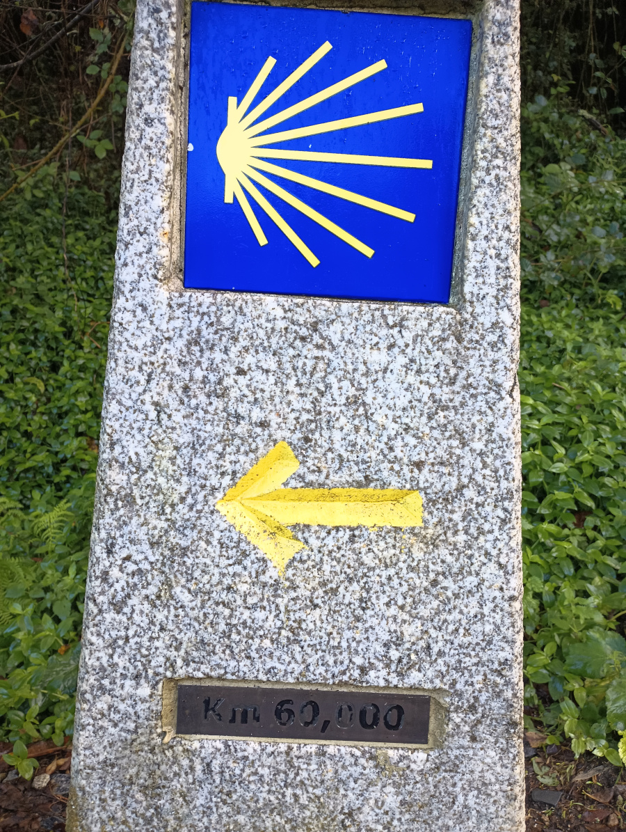 Stome camino marker showing 60 kilometres.