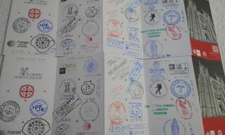 Pilgrim credential with stamps.