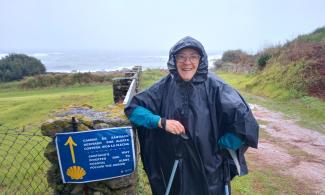 Woman in rain poncho.